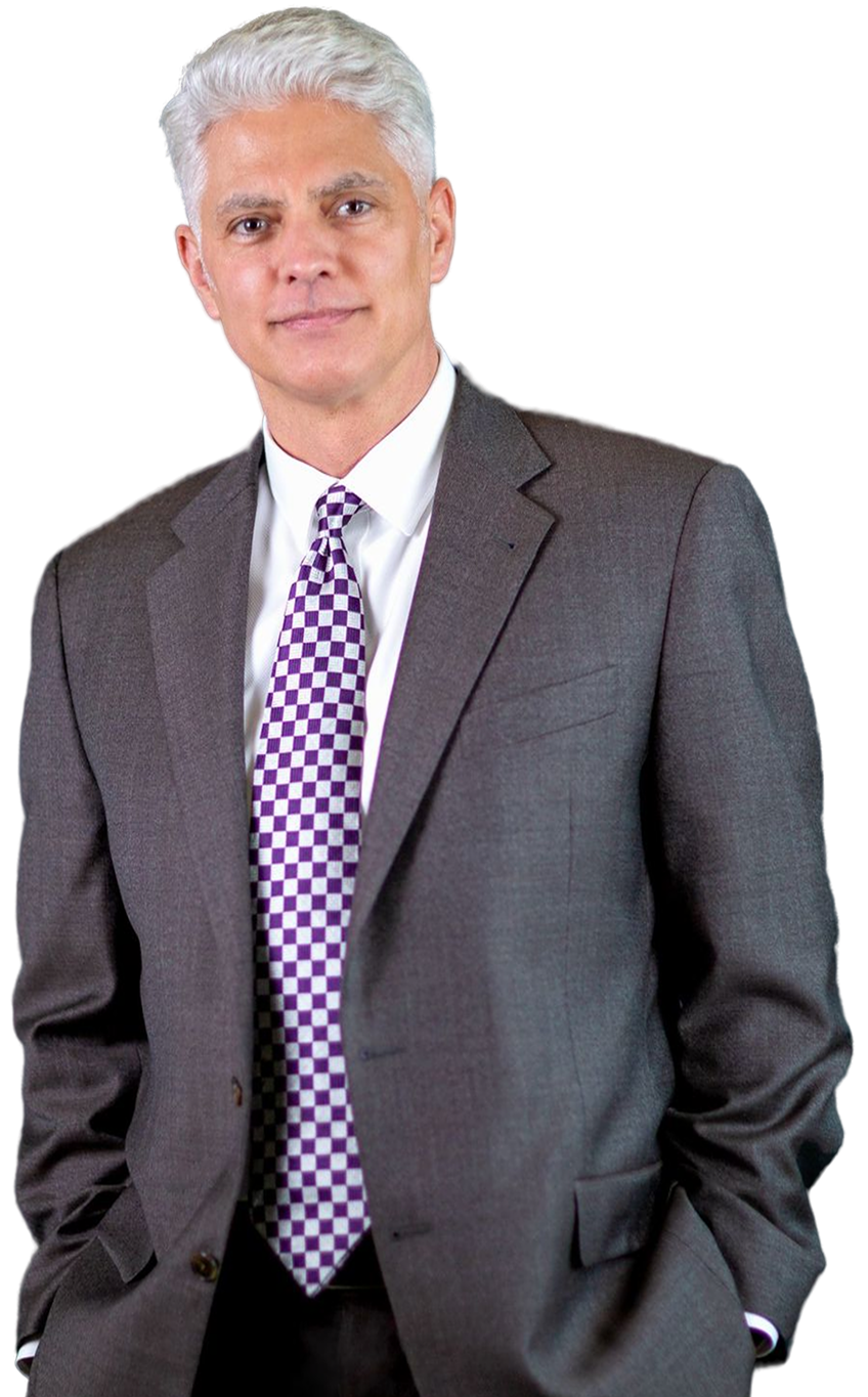 Close-up portrait of attorney Grant Gehrmann smiling in a gray suit